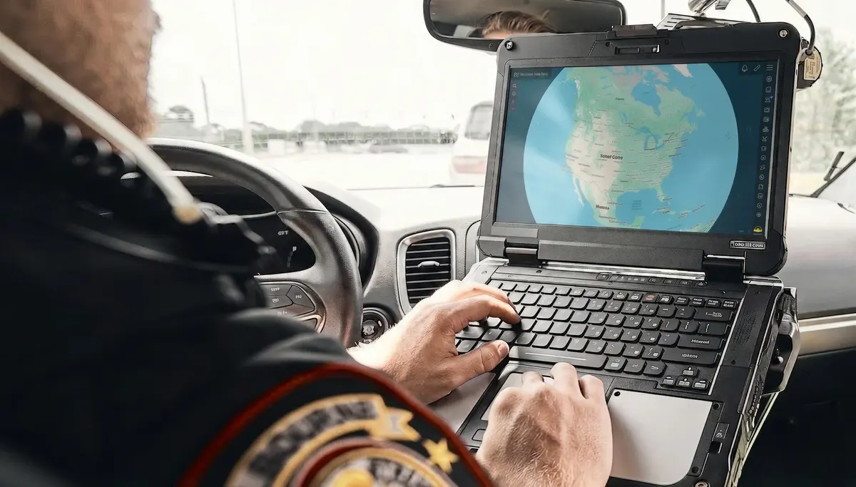 Officer running CloudTAK on a rugged laptop from a vehicle