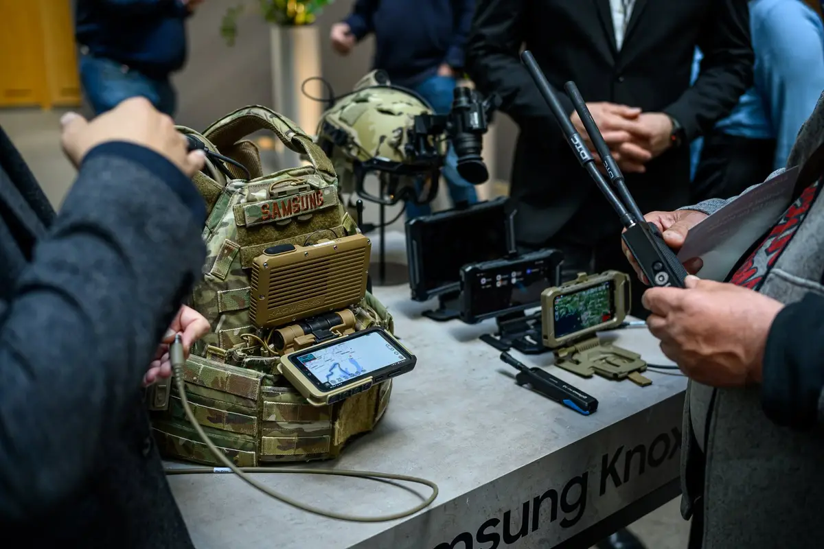 Chest-mounted rugged Android device showing an ATAK map on a plate carrier